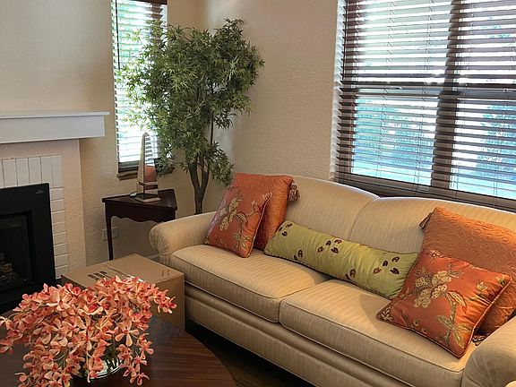 spacious living room with new window coverings