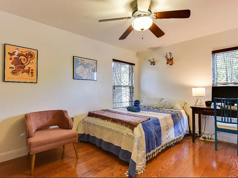 Second bedroom at back corner. Closet off photo to right