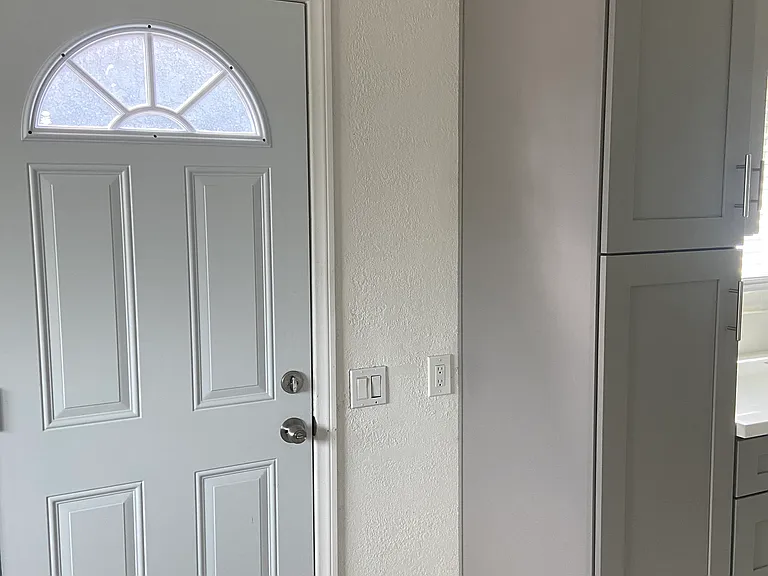 Kitchen door adjacent to dining nook
