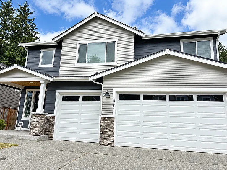 Front of the house with 3 car carage