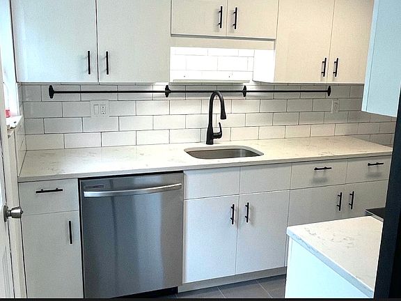 Newly remodeled kitchen with modern cabinets, stainless steel appliances, and quartz counter top.