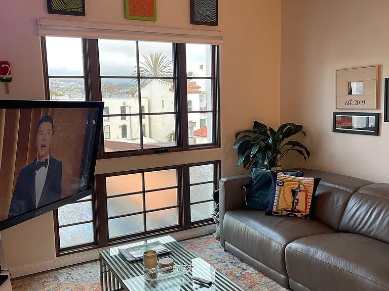 Living room with 55" TV, Direct TV and all major streaming channels, and power seats couch