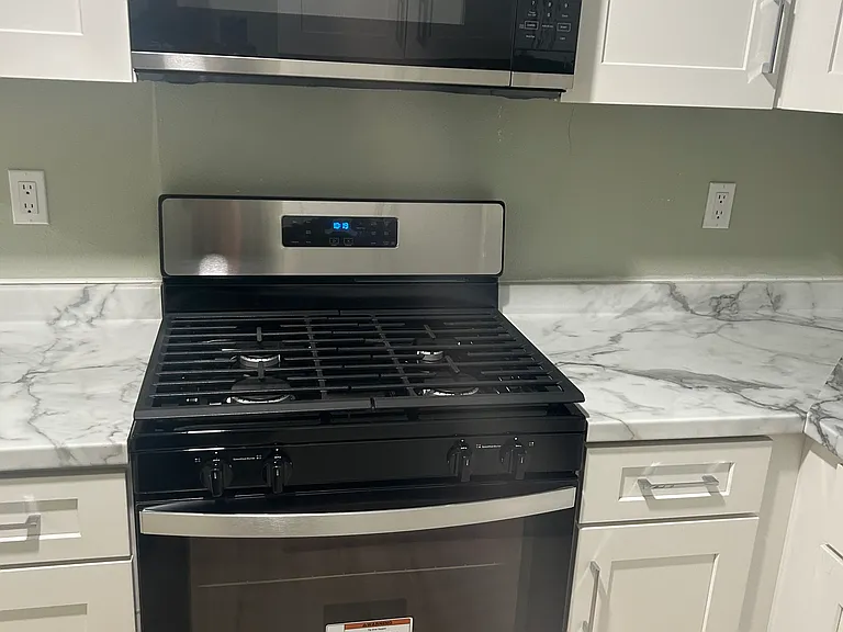 Gas stove and microwave included.
