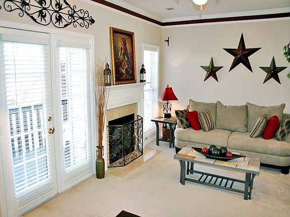 View of Living Room Fireplace and Access to Private Back Deck
