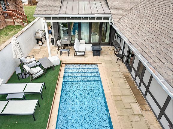 Beautiful courtyard pool to enjoy year-round. The turf can be moved over the pool area to create a larger backyard space or to cover the pool if desired