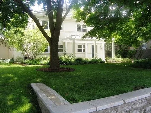 Front View of the Property, shaded by a large oak tree and one of few American Ash saved from the EAB.