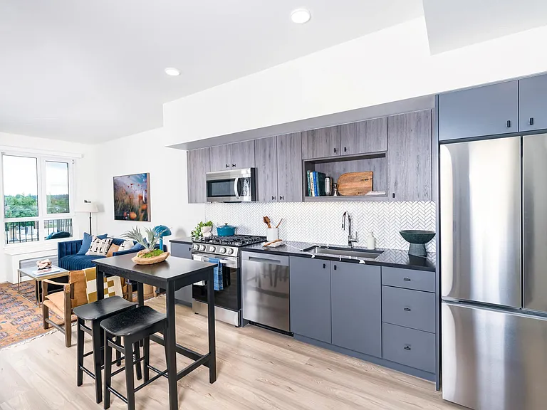 Gourmet kitchens with quartz countertops, custom cabinetry with soft close, and under-cabinet lighting.