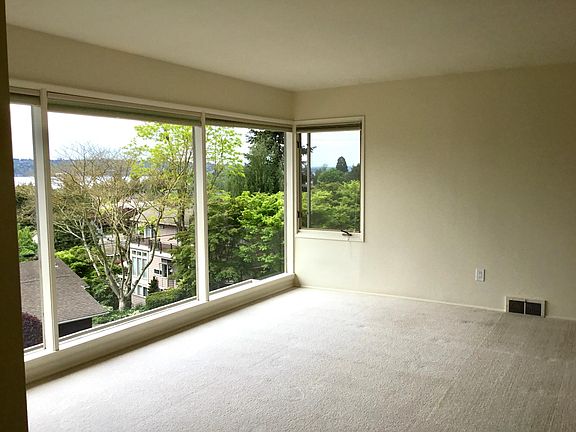 Wall of windows in living room.