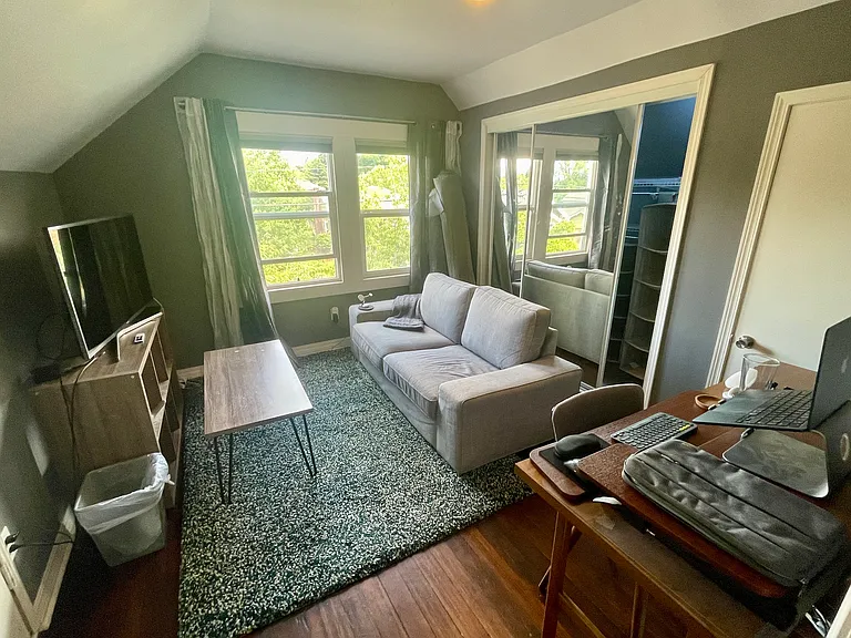 The bonus room connected to primary bedroom: TV room and office