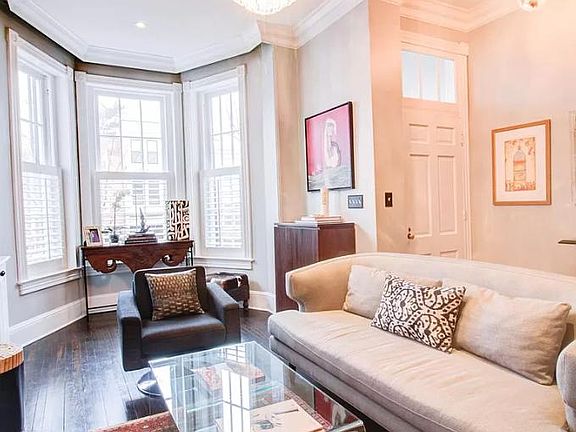 Large windows flood the living room with light