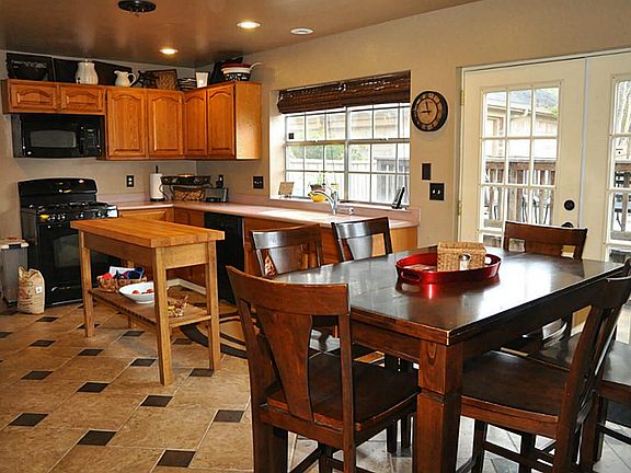Kitchen and breakfast area. Open. Beautiful tile floor and updated kitchen.