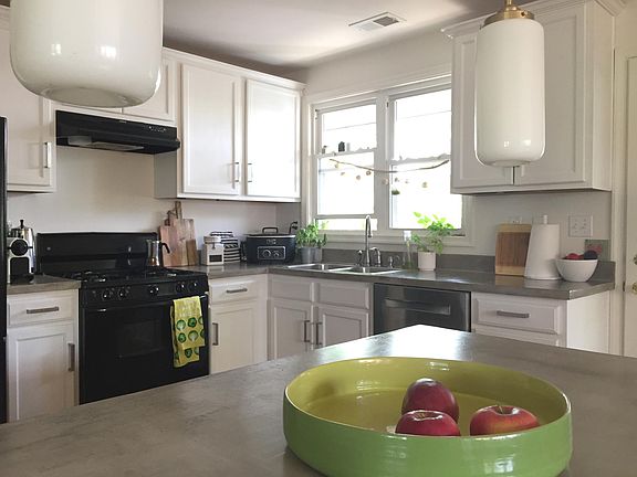 white kitchen with concrete counters
