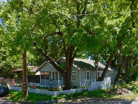 Many trees shade this home