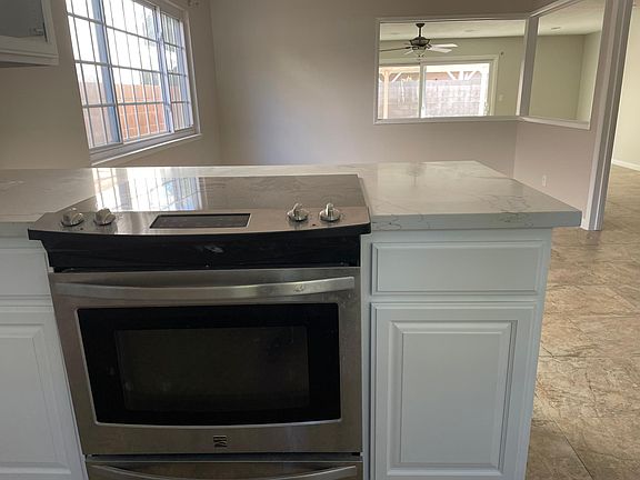 Brand New Quartz countertop. Slip your bar stools underneath or eat in your attached dining room.