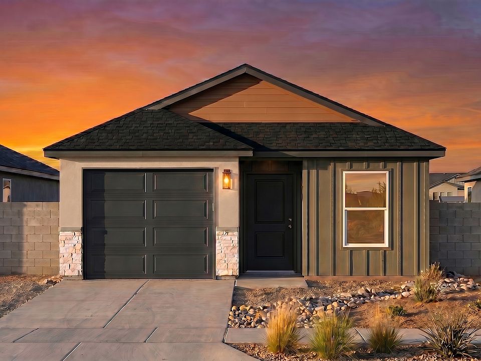 A small, modern house with a single-car garage, dark roof, and wooden accents is shown at sunset. Th