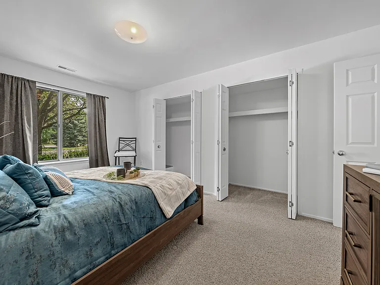 Bedroom with Ample storage space at Prentiss Pointe Apartments in Harrison Township, MI