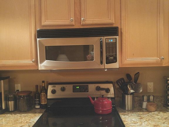Kitchen has an electric range/stove. Large, new refrigerator. Every small appliance you could want/need. Complete set of dishes for 6 (plus many extras). Lots of pots, pans, baking sheets, etc. There is a separate walk-in pantry.