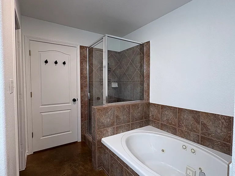 Master bathroom with large walk in closet
