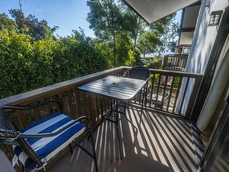 From the master bedroom patio, listen to the waves and view the ocean.