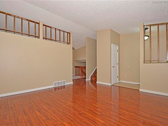 Gleaming hardwood laminate in Living Room.