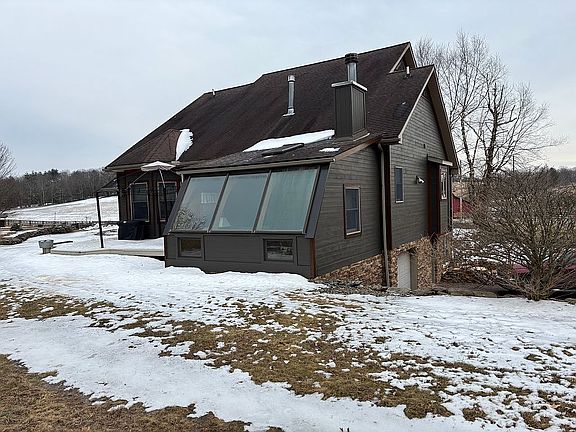 Back of home with Sun Room 