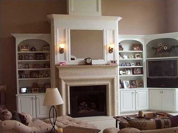 The Great Room warmly welcomes guests...its gorgeous woodwork is a work of art in this builder's own home.