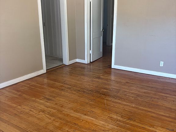 From the living room looking towards the kitchen and bedroom doors