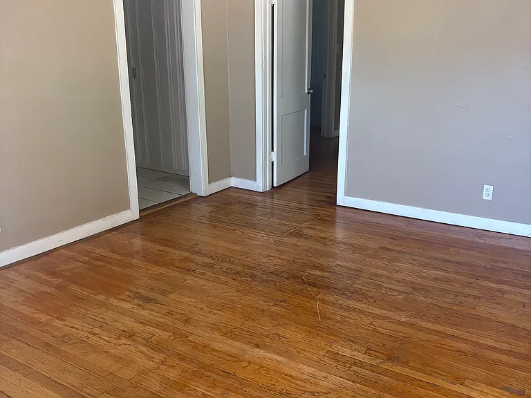 From the living room looking towards the kitchen and bedroom doors