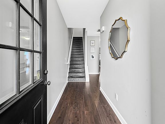 Entrance complete with engineered hardwood floors