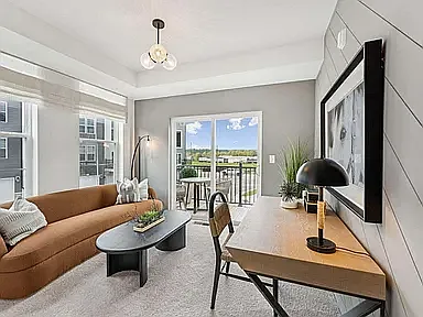 A well-appointed room with sliding glass doors to the deck, ideal as a home office additional bedroom, or as a guest room. This room features upgraded lighting, window treatments, an elegant accent wall, and a spacious closet.