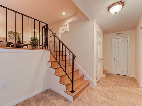 Spacious foyer with closet and new tiled flooring
