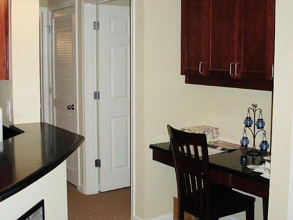 Desk alcove with bedroom door on right.