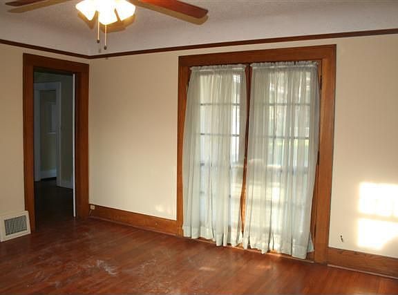 Double doors leading to the small back yard and parking