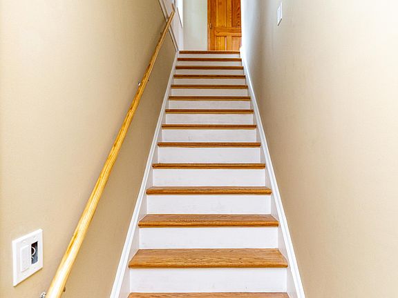 The staircase leading to the second floor top apartment.