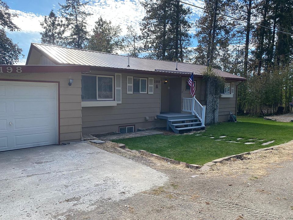 Front of house plus garage.