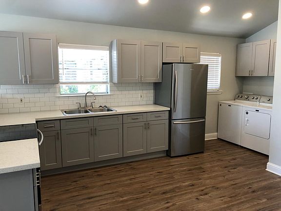 Durable vinyl flooring throughout.