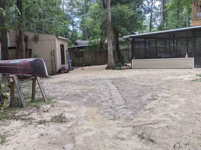 View of the screen in patio and detached garage.