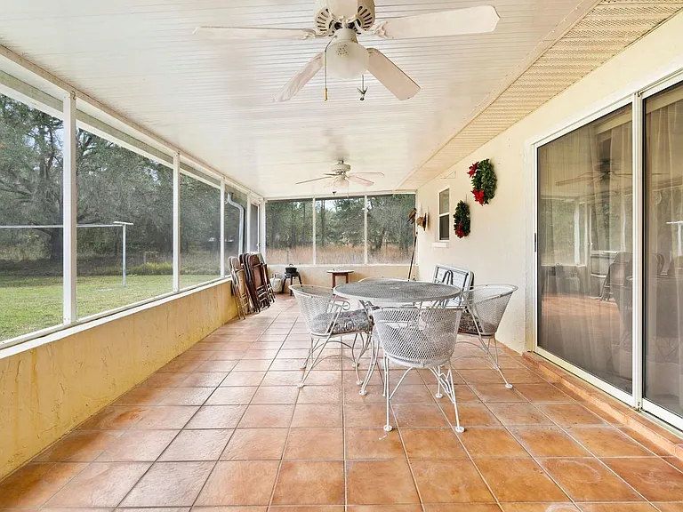 Screened covered patio, view from living area.
