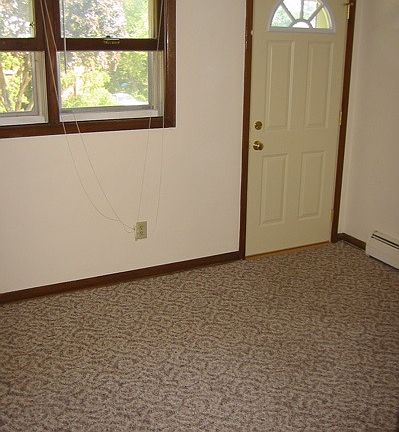 One bedroom features door to balcony