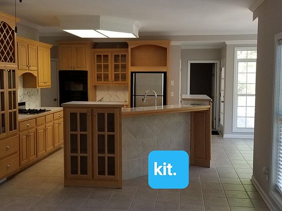 View of the kitchen from the family room. Breakfast nook on the right and the laundry room straight back.