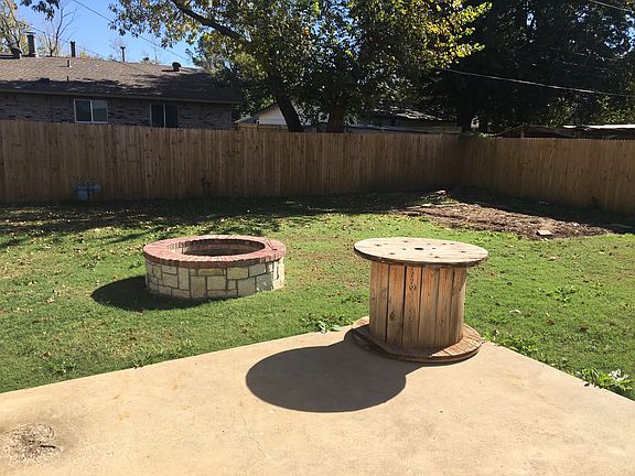Back yard-fenced and a fire pit