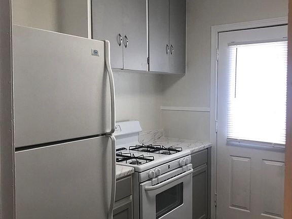 Kitchen with door to side yard