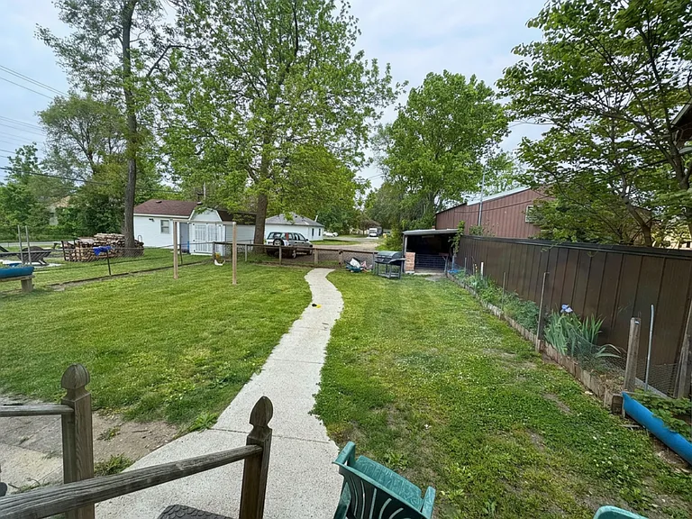 Backyard with shed and designated parking area