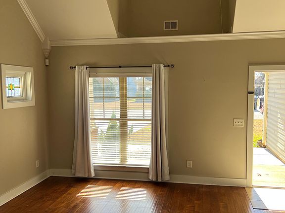 Living room from kitchen including dormer and stained glass window!