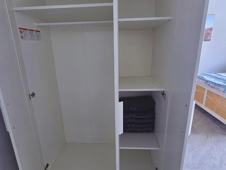 Enjoy a roomy closet designed for a comfortable and organized stay.