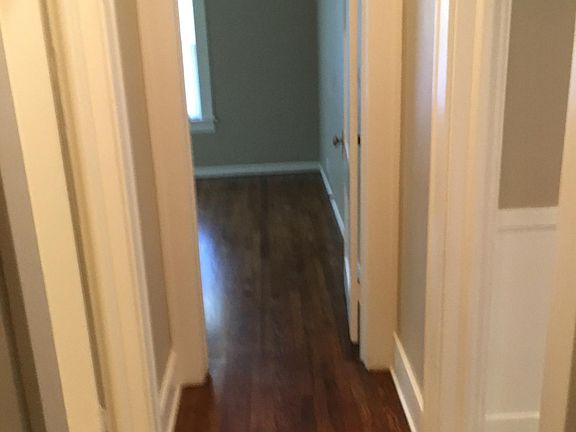 Small hallway that joins both bedrooms and bathroom