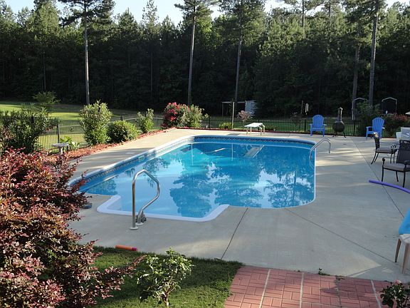 Pool with diving board and deck jets