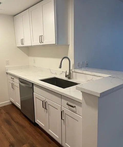 Kitchen with counter top for barstool(s). Cable hookup on wall.