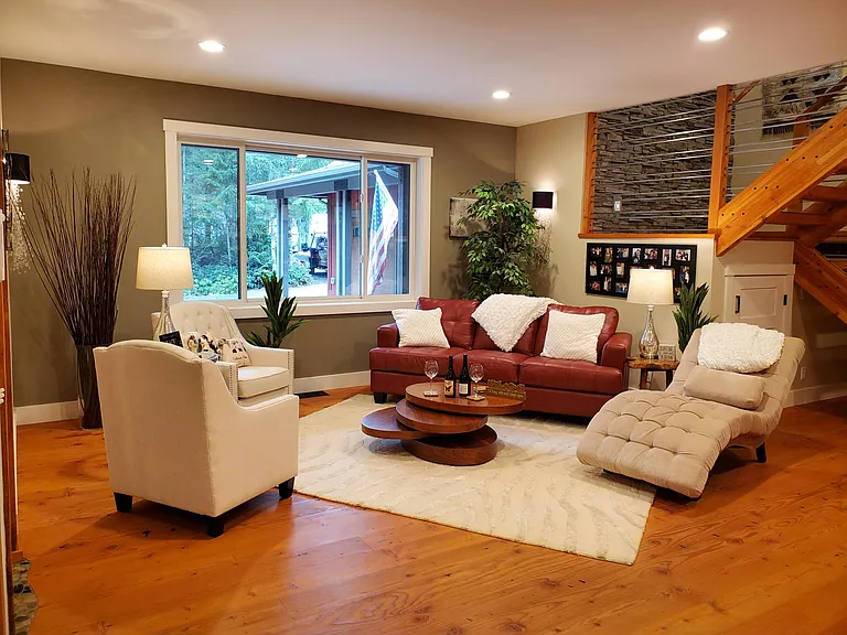 The "Diva Den" is located near the entry of the home, no TV, just comfortable seating to lounge and read a book, or invite friends over to catch up on life