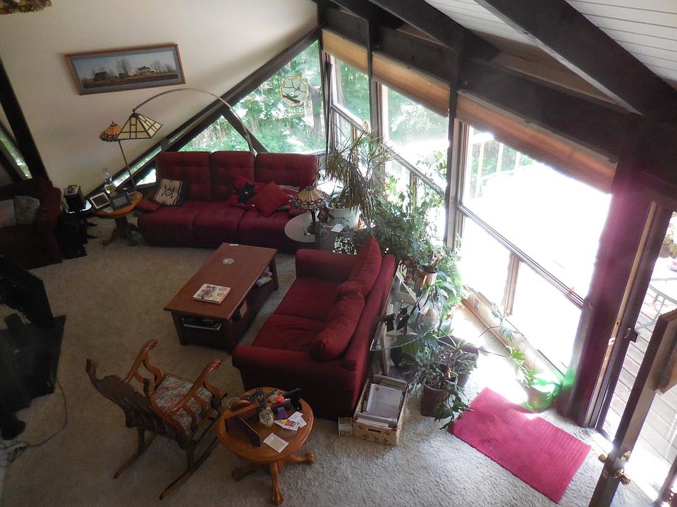 View of living room from spiral staircase.